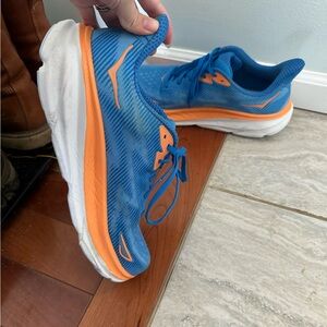 Size 12 men’s blue and orange hoka shoes worn a couple times on treadmill only